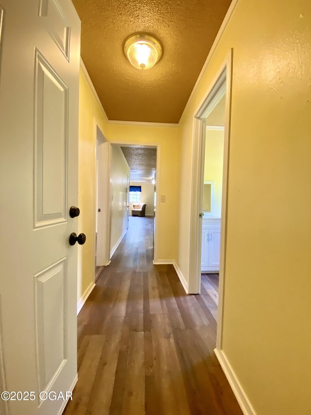 21522 Old Ritchey Rd, Granby, MO 64844 - hall with a textured ceiling, dark wood-style flooring, and baseboards