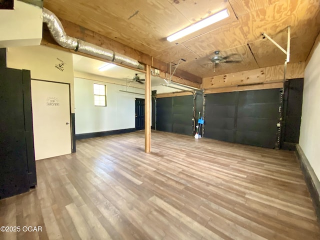 21522 Old Ritchey Rd, Granby, MO 64844 - garage featuring a ceiling fan and baseboards