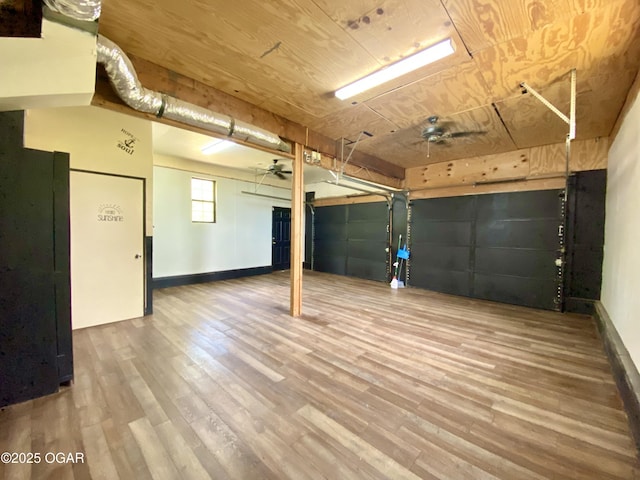 21522 Old Ritchey Rd, Granby, MO 64844 - below grade area with wood finished floors, a ceiling fan, and baseboards