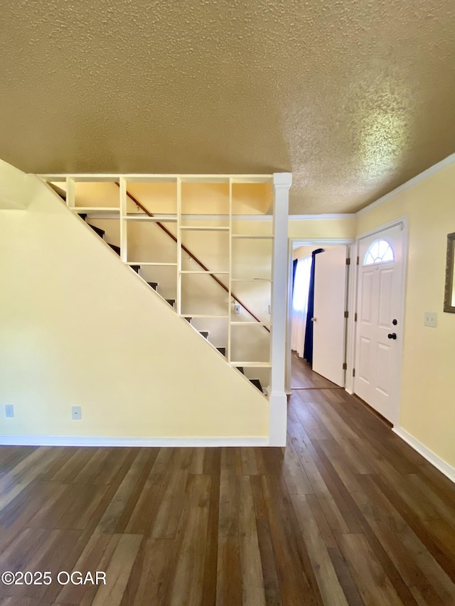 21522 Old Ritchey Rd, Granby, MO 64844 - foyer entrance with stairway, wood finished floors, a textured ceiling, crown molding, and baseboards