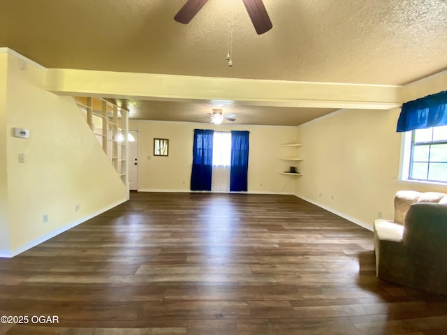 21522 Old Ritchey Rd, Granby, MO 64844 - unfurnished living room with ceiling fan, a textured ceiling, healthy amount of natural light, and wood finished floors
