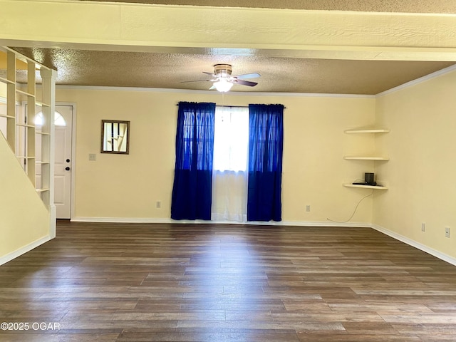 21522 Old Ritchey Rd, Granby, MO 64844 - unfurnished living room featuring wood finished floors, ceiling fan, crown molding, a textured ceiling, and baseboards