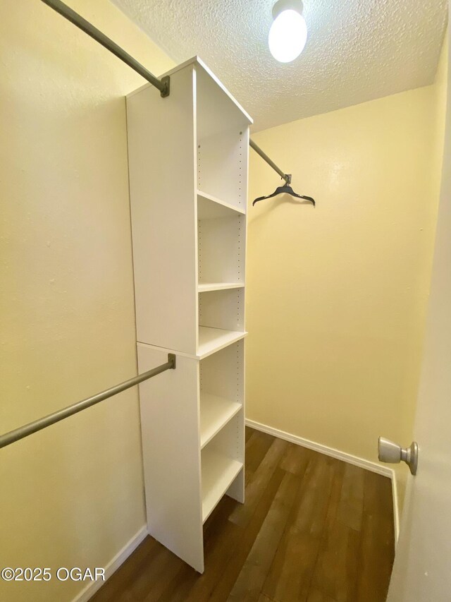 21522 Old Ritchey Rd, Granby, MO 64844 - spacious closet featuring dark wood finished floors