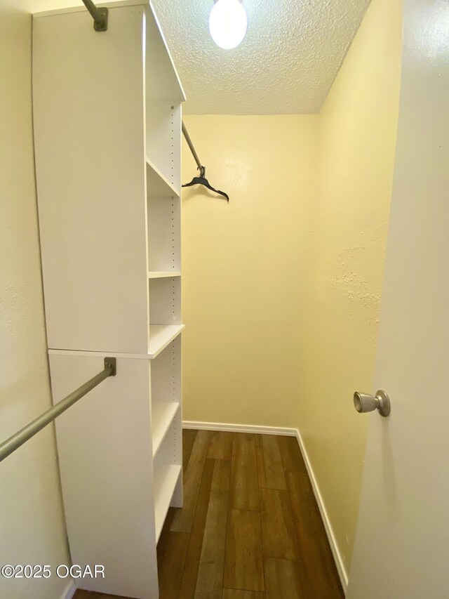 21522 Old Ritchey Rd, Granby, MO 64844 - walk in closet featuring dark wood finished floors