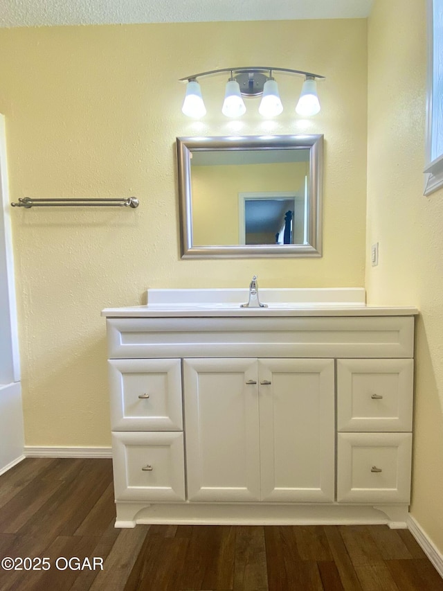 21522 Old Ritchey Rd, Granby, MO 64844 - bathroom with wood finished floors, baseboards, and vanity