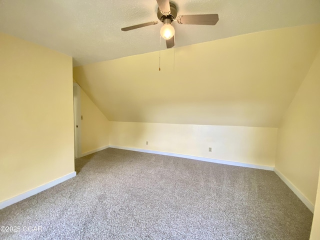 21522 Old Ritchey Rd, Granby, MO 64844 - additional living space with vaulted ceiling, carpet flooring, a ceiling fan, and baseboards
