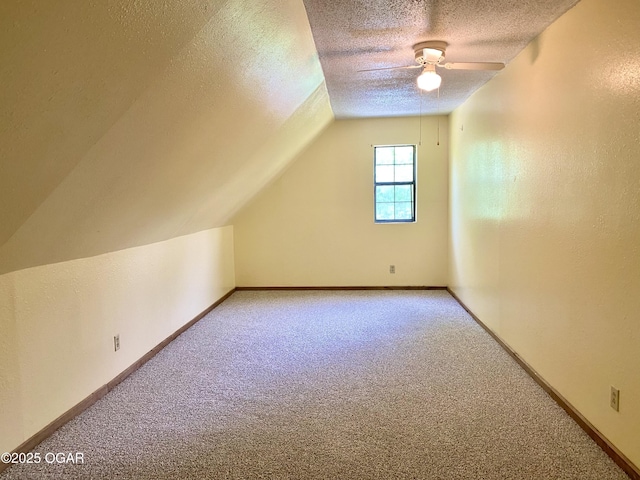 21522 Old Ritchey Rd, Granby, MO 64844 - bonus room featuring carpet, a textured ceiling, vaulted ceiling, ceiling fan, and baseboards