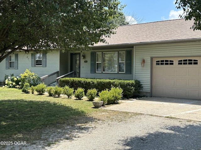 600 W Mercer, Jasper, MO 64755 - ranch-style home with an attached garage, driveway, a shingled roof, and a front yard
