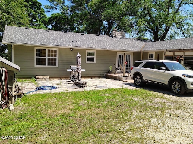 6468 Dogwood Rd, Reeds, MO 64859 - rear view of house with a yard, a chimney, a patio, and french doors