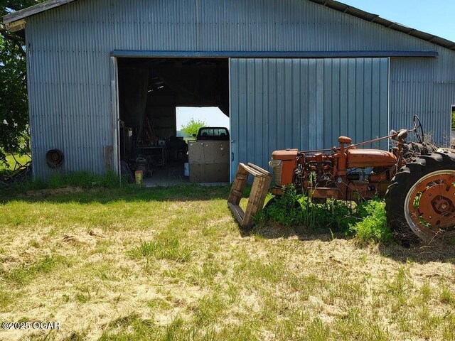 6468 Dogwood Rd, Reeds, MO 64859 - view of pole building with a yard