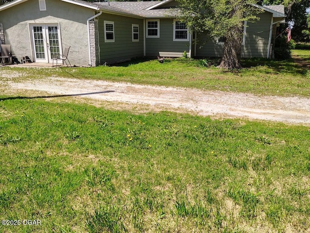 6468 Dogwood Rd, Reeds, MO 64859 - view of grassy yard featuring french doors