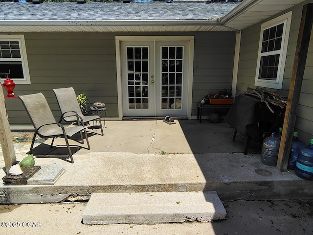 6468 Dogwood Rd, Reeds, MO 64859 - doorway to property featuring french doors, a patio area, and roof with shingles