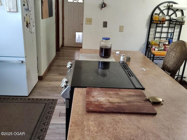 6468 Dogwood Rd, Reeds, MO 64859 - dining room featuring wood finished floors and baseboards