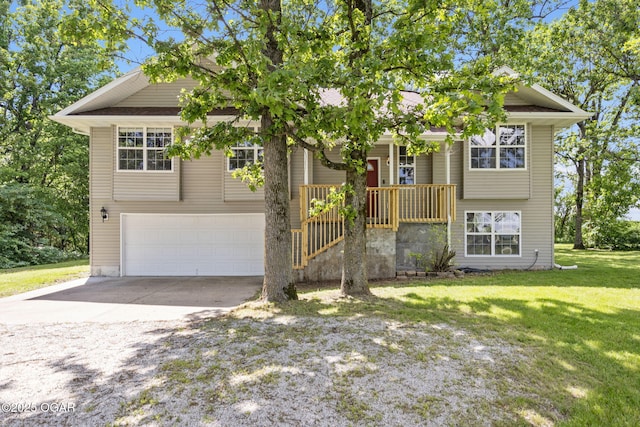 9969 Lawrence Unit 2222, Monett, MO 65708 - view of front of house with driveway, an attached garage, and a front lawn