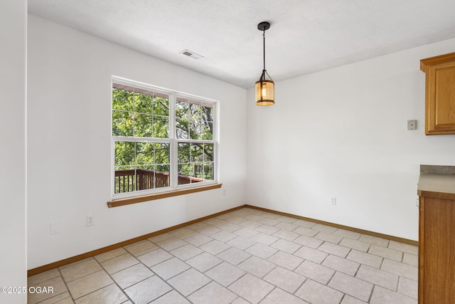 9969 Lawrence Unit 2222, Monett, MO 65708 - unfurnished dining area with healthy amount of natural light and baseboards