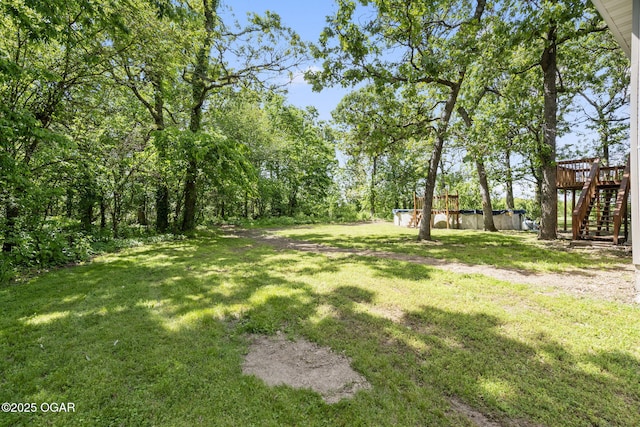 9969 Lawrence Unit 2222, Monett, MO 65708 - view of grassy yard with stairway and a wooden deck