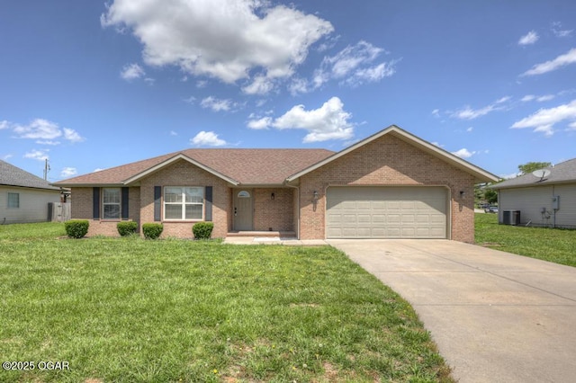 ranch-style house with central AC unit, an attached garage, brick siding, concrete driveway, and a front lawn