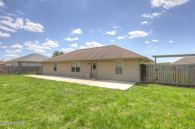 back of property with a patio
