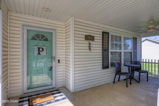 property entrance featuring covered porch and ceiling fan
