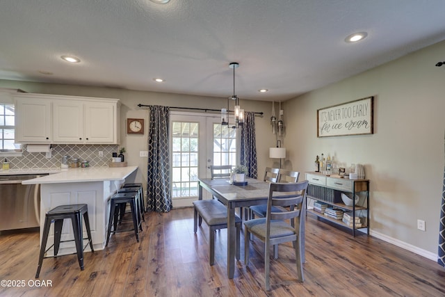 dining room featuring dark wood finished floors, recessed lighting, baseboards, and french doors