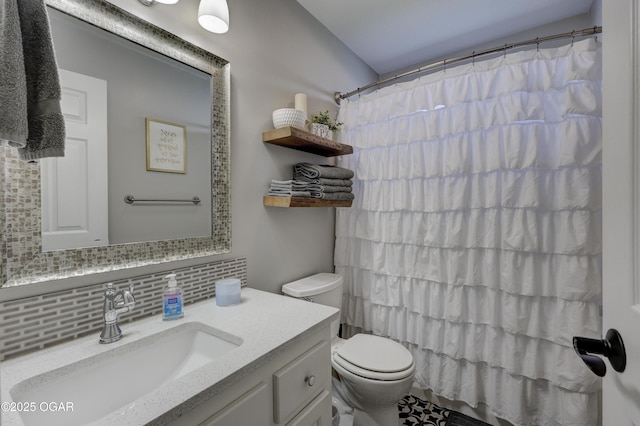 full bath with tasteful backsplash, toilet, and vanity