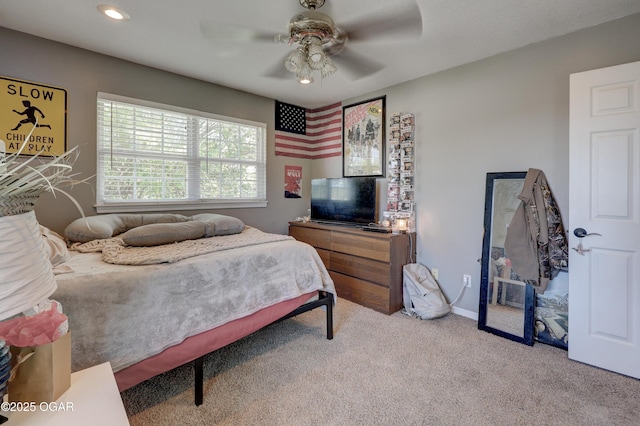 carpeted bedroom featuring recessed lighting, ceiling fan, and baseboards