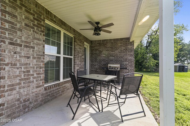 view of patio featuring ceiling fan and outdoor dining space