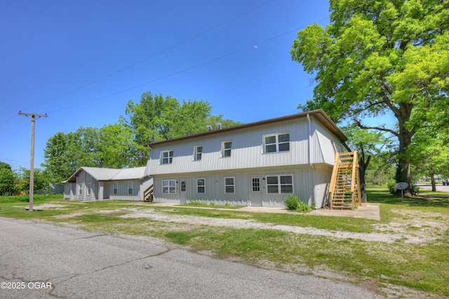238 E 21st St, Baxter Springs, KS 66713 - view of front of home featuring stairway and a deck