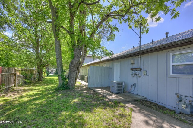 238 E 21st St, Baxter Springs, KS 66713 - view of yard featuring central AC