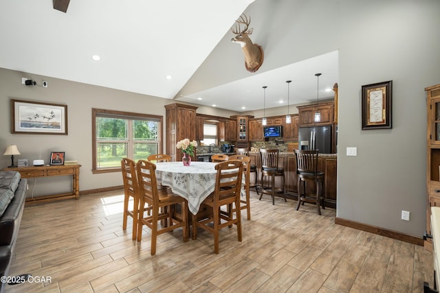 12244 County Rd 227, Oronogo, MO 64855 - dining room featuring high vaulted ceiling, light wood-type flooring, baseboards, and recessed lighting