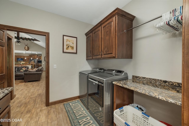 12244 County Rd 227, Oronogo, MO 64855 - clothes washing area with cabinet space, washing machine and clothes dryer, light wood-style flooring, and baseboards
