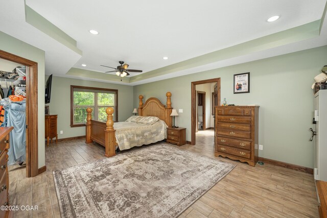 12244 County Rd 227, Oronogo, MO 64855 - bedroom with a raised ceiling, light wood-type flooring, recessed lighting, baseboards, and a spacious closet
