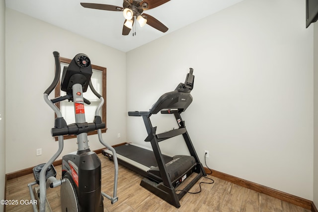 12244 County Rd 227, Oronogo, MO 64855 - workout area featuring baseboards, ceiling fan, and wood finished floors