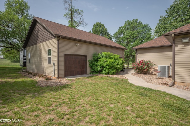 12244 County Rd 227, Oronogo, MO 64855 - view of grassy yard featuring a garage