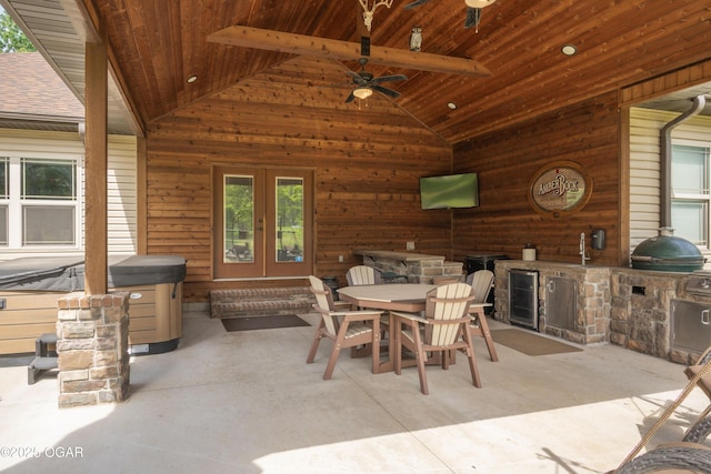 12244 County Rd 227, Oronogo, MO 64855 - view of patio featuring an outdoor kitchen, french doors, an indoor hot tub, outdoor dining space, and a ceiling fan