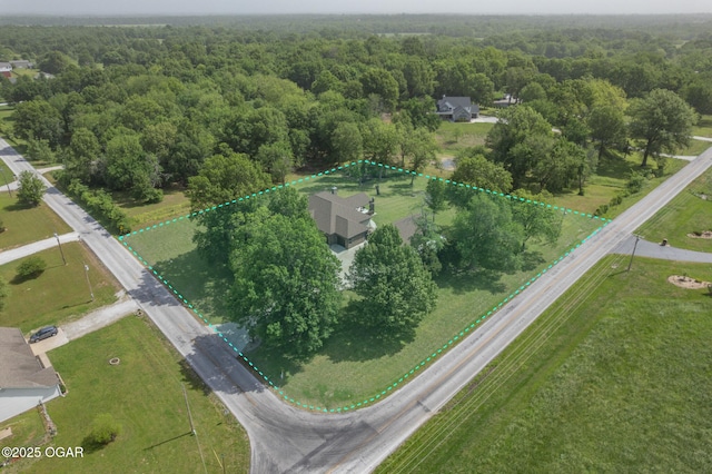 12244 County Rd 227, Oronogo, MO 64855 - aerial view of property and surrounding area with a heavily wooded area and property boundaries highlighted