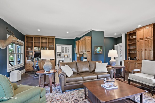 living area with recessed lighting, crown molding, wood finished floors, and built in features