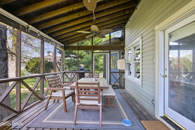 sunroom featuring ceiling fan and healthy amount of natural light