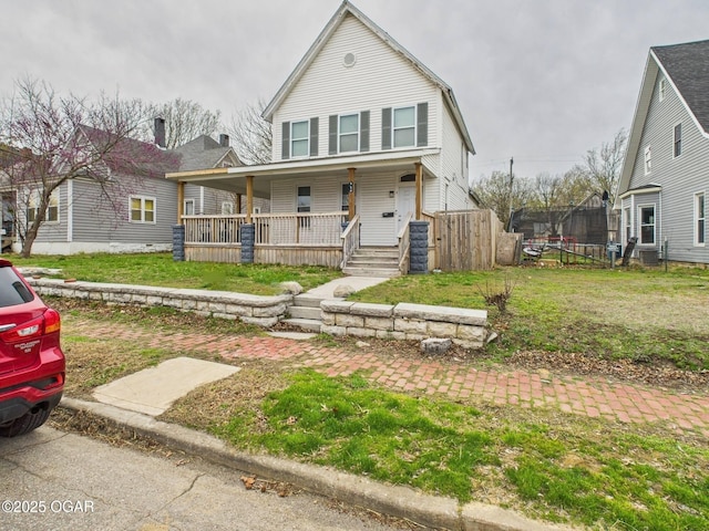 720 Chestnut Ave, Joplin, MO 64801 - view of front of home with covered porch and a front yard