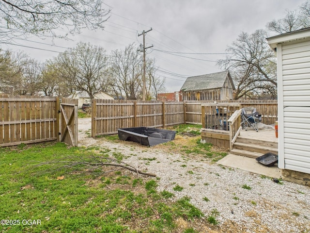 720 Chestnut Ave, Joplin, MO 64801 - fenced backyard featuring a wooden deck