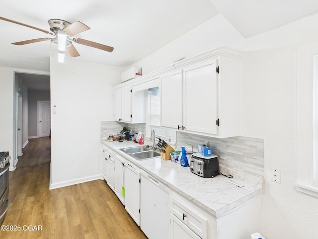 720 Chestnut Ave, Joplin, MO 64801 - kitchen with a sink, decorative backsplash, ceiling fan, and white cabinets
