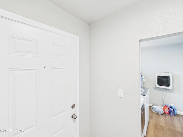 720 Chestnut Ave, Joplin, MO 64801 - laundry room with heating unit, wood finished floors, baseboards, and separate washer and dryer