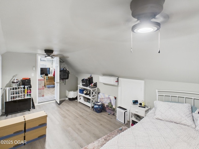 720 Chestnut Ave, Joplin, MO 64801 - bedroom featuring wood finished floors, vaulted ceiling, and a ceiling fan