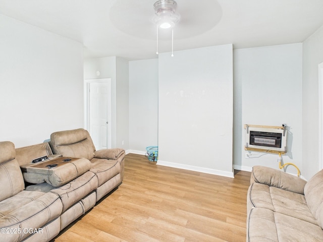 720 Chestnut Ave, Joplin, MO 64801 - living area featuring heating unit, light wood-type flooring, ceiling fan, and baseboards