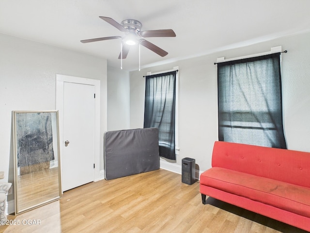 720 Chestnut Ave, Joplin, MO 64801 - living area with wood finished floors, ceiling fan, and baseboards