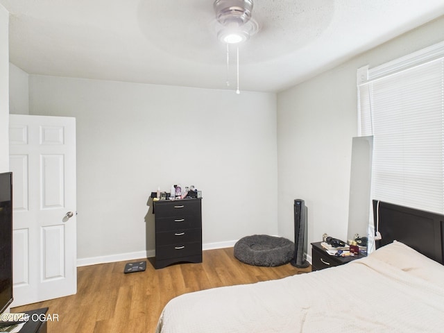 720 Chestnut Ave, Joplin, MO 64801 - bedroom featuring wood finished floors, baseboards, and ceiling fan