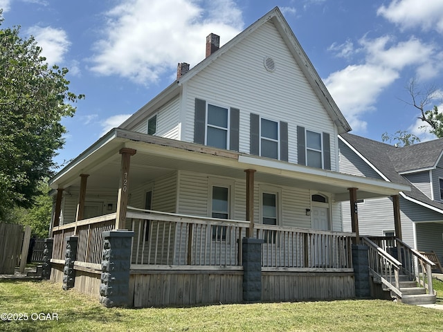 720 Chestnut Ave, Joplin, MO 64801 - farmhouse-style home featuring a porch, a chimney, and a front yard