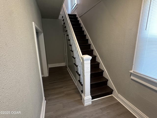 720 Chestnut Ave, Joplin, MO 64801 - staircase featuring wood finished floors, a textured wall, and baseboards