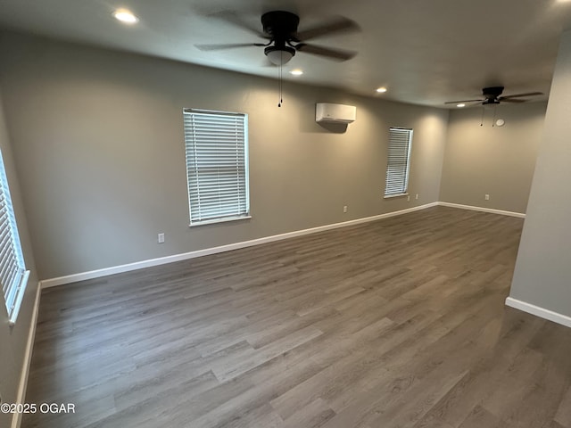 720 Chestnut Ave, Joplin, MO 64801 - spare room featuring ceiling fan, recessed lighting, dark wood finished floors, baseboards, and a wall mounted air conditioner