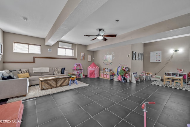 recreation room with ceiling fan, a wall unit AC, and tile patterned flooring